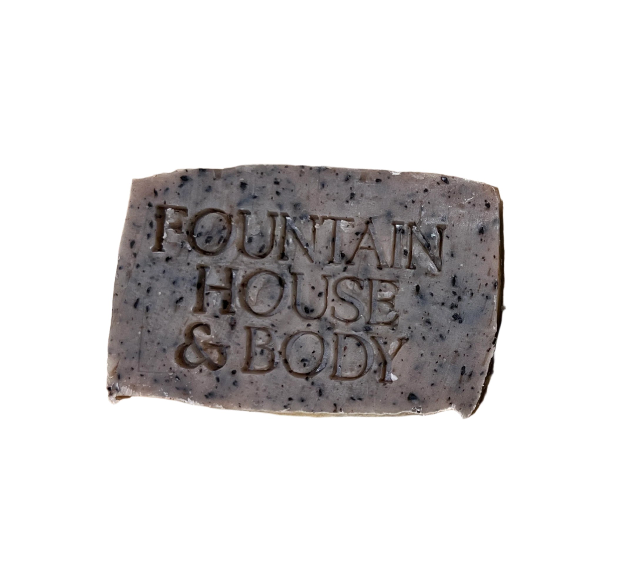 Brown bar of soap with flecks of coffee