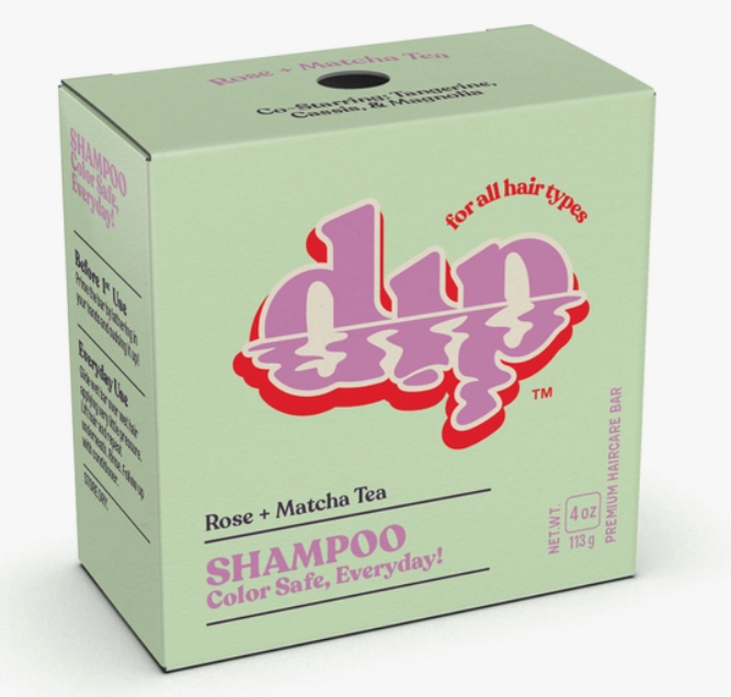 green paper box with shampoo bar inside