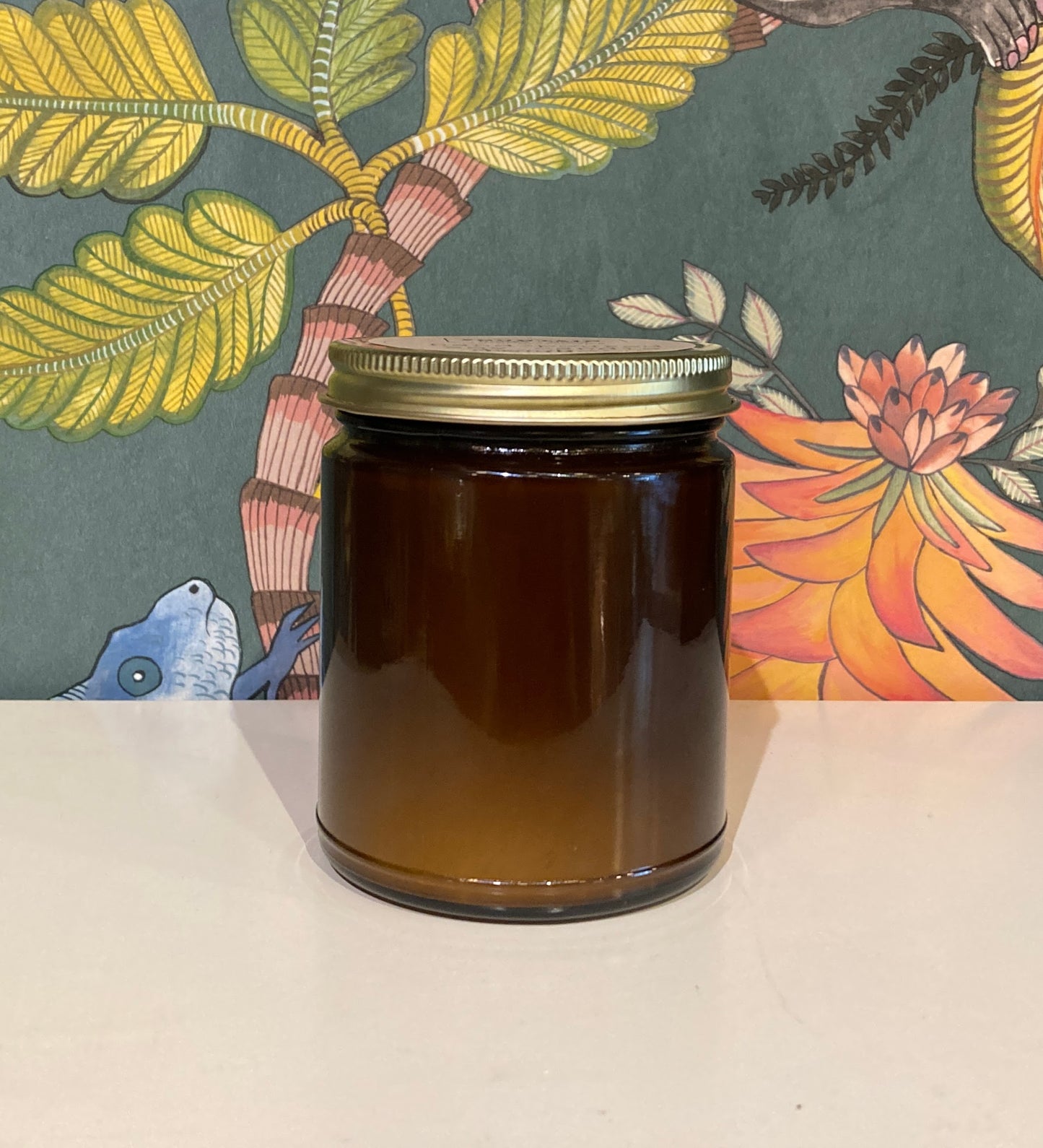 Hand-poured candle in 9 oz amber glass jars