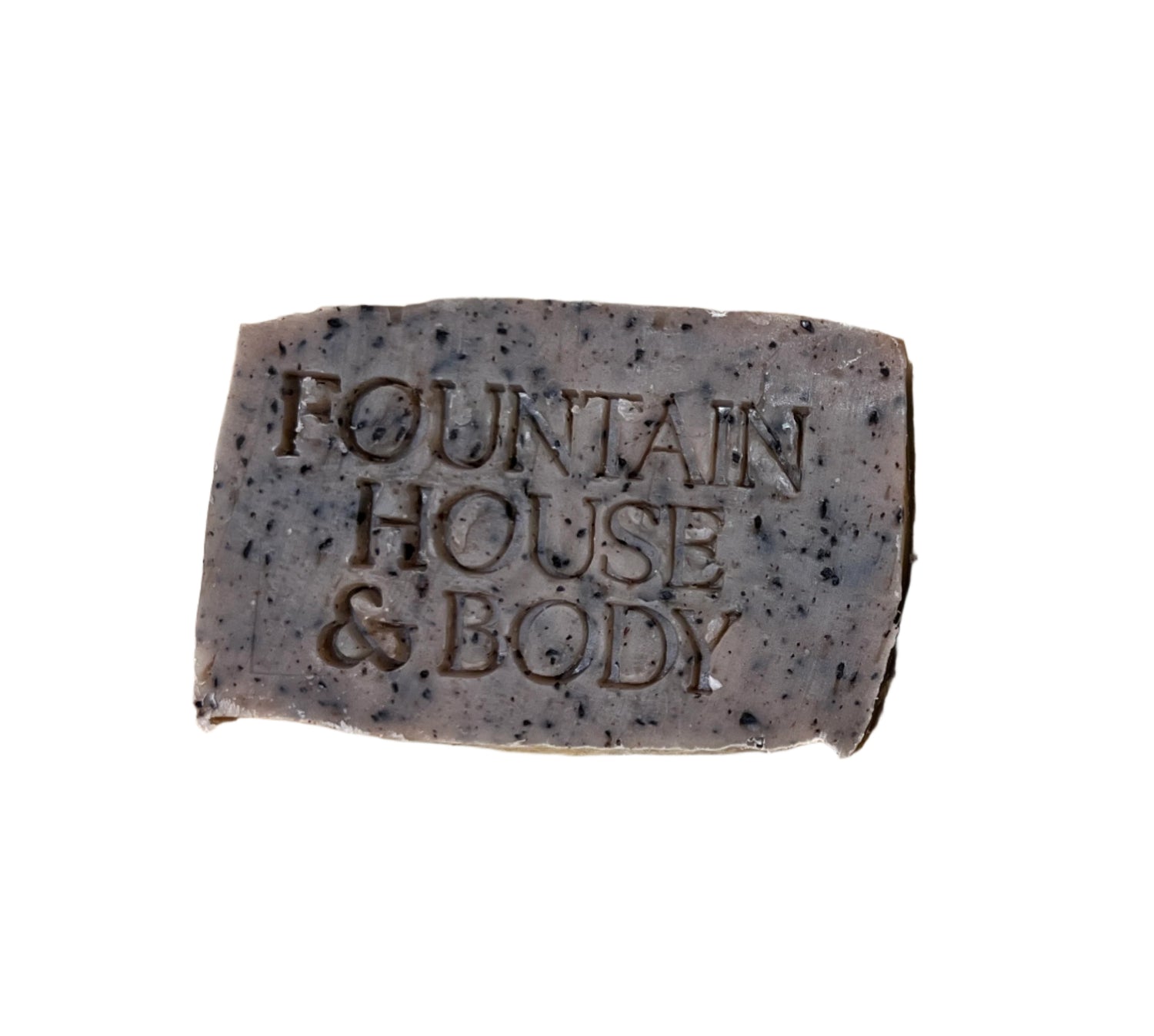 Brown bar of soap with flecks of coffee