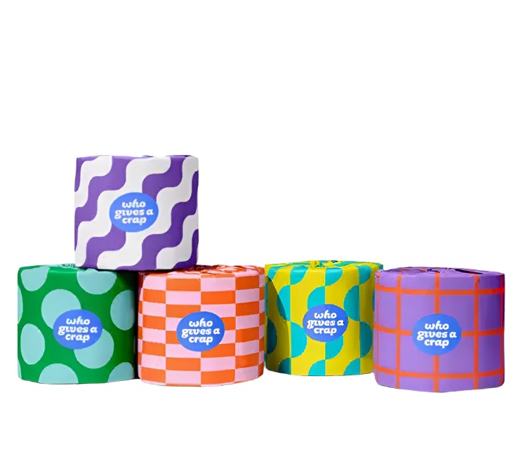 rolls of recycled toilet paper in colorful paper wrapping