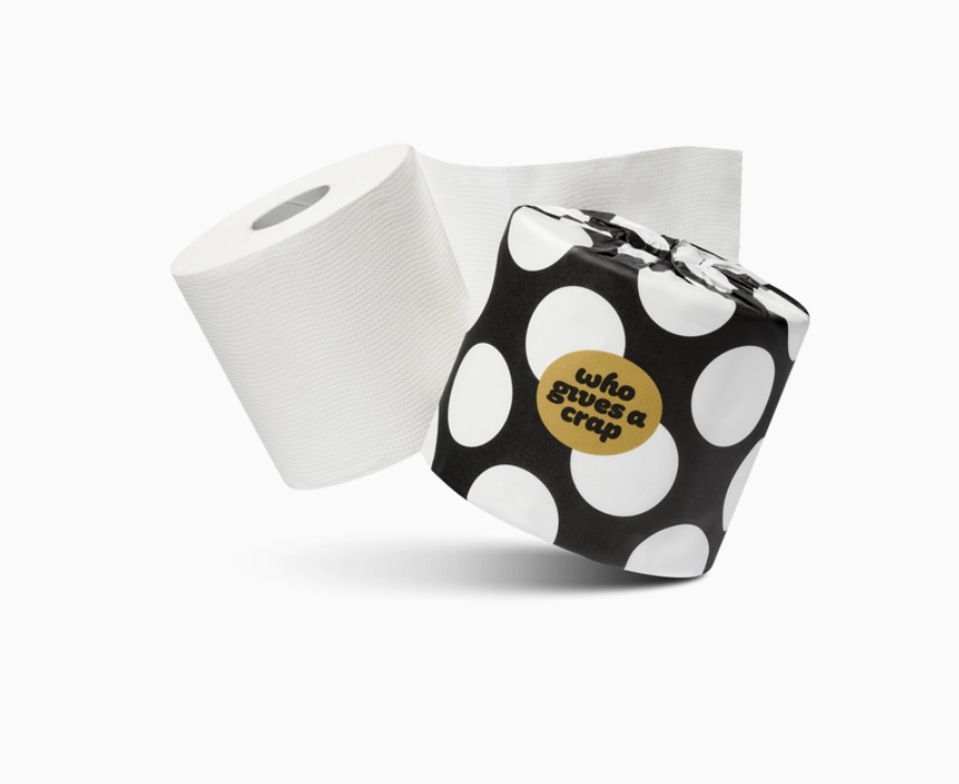 roll of bamboo toilet paper in a black and white paper wrappr