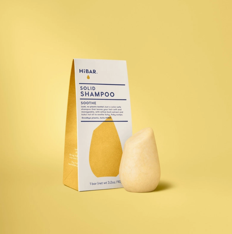 Yellow shampoo bar in paper box